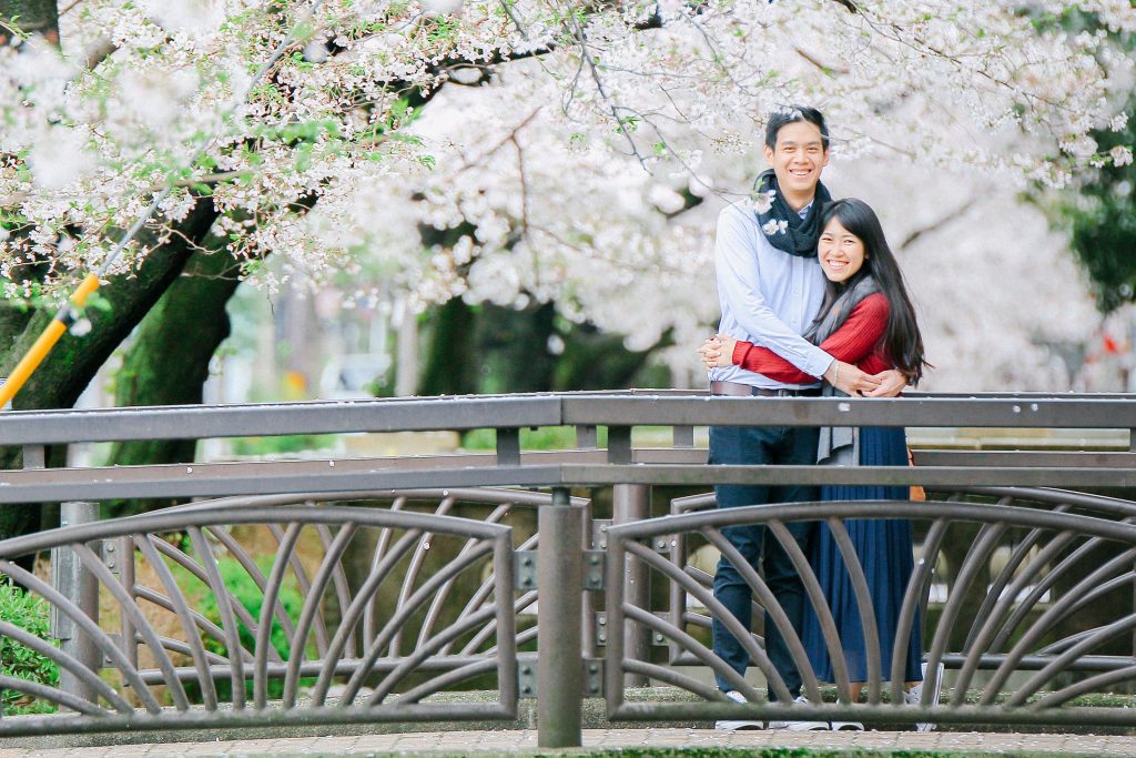 Engagement photoshoot with cherry blossoms by freelance wedding photographer in Kyoto
